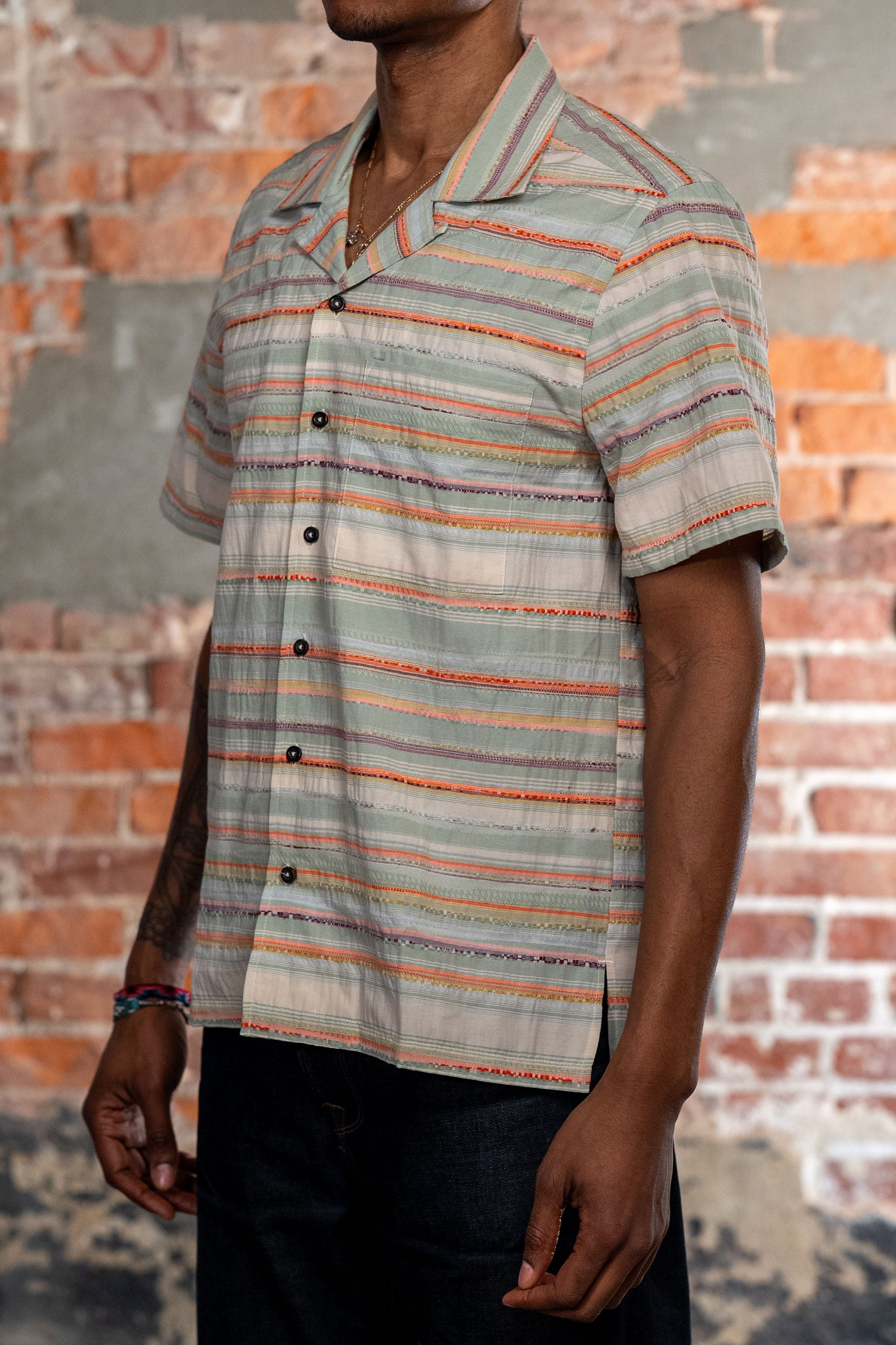 Hansen Garments Caleb Short Sleeve Cabana Shirt - Multicolor - model shot - side facing - brick background
