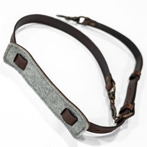 Brown leather strap with trigger hooks underside