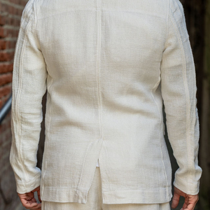 Hansen Garments Charlie Three Button Blazer - Off White Gauze - model shot - alley background - back facing 