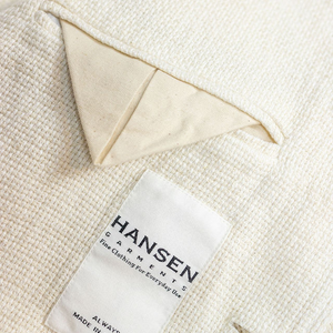 Hansen Garments Charlie Three Button Blazer - Off White Gauze - product shot - close up detail of tag, fabric, and inner pocket
