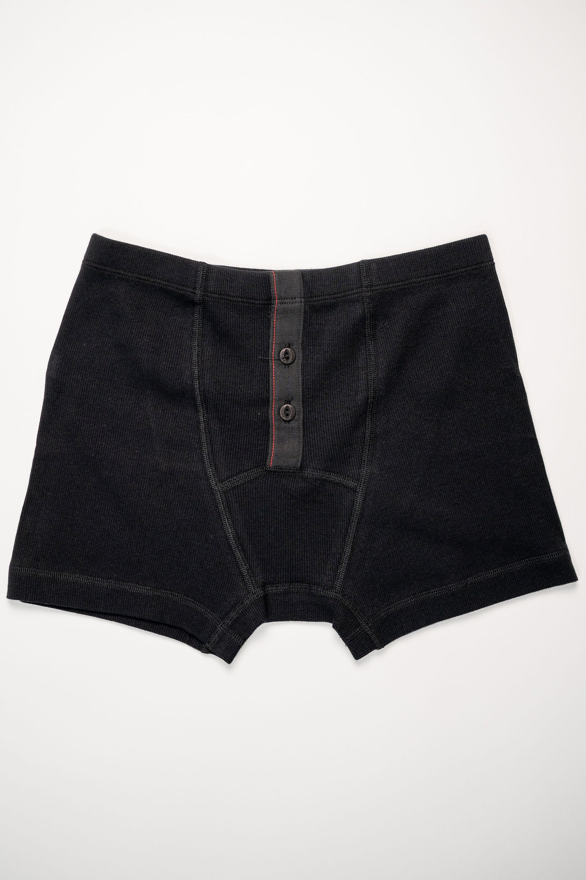 Hemen Biarritz Ribbed Boxer Brief - Solid Black. Laid on back