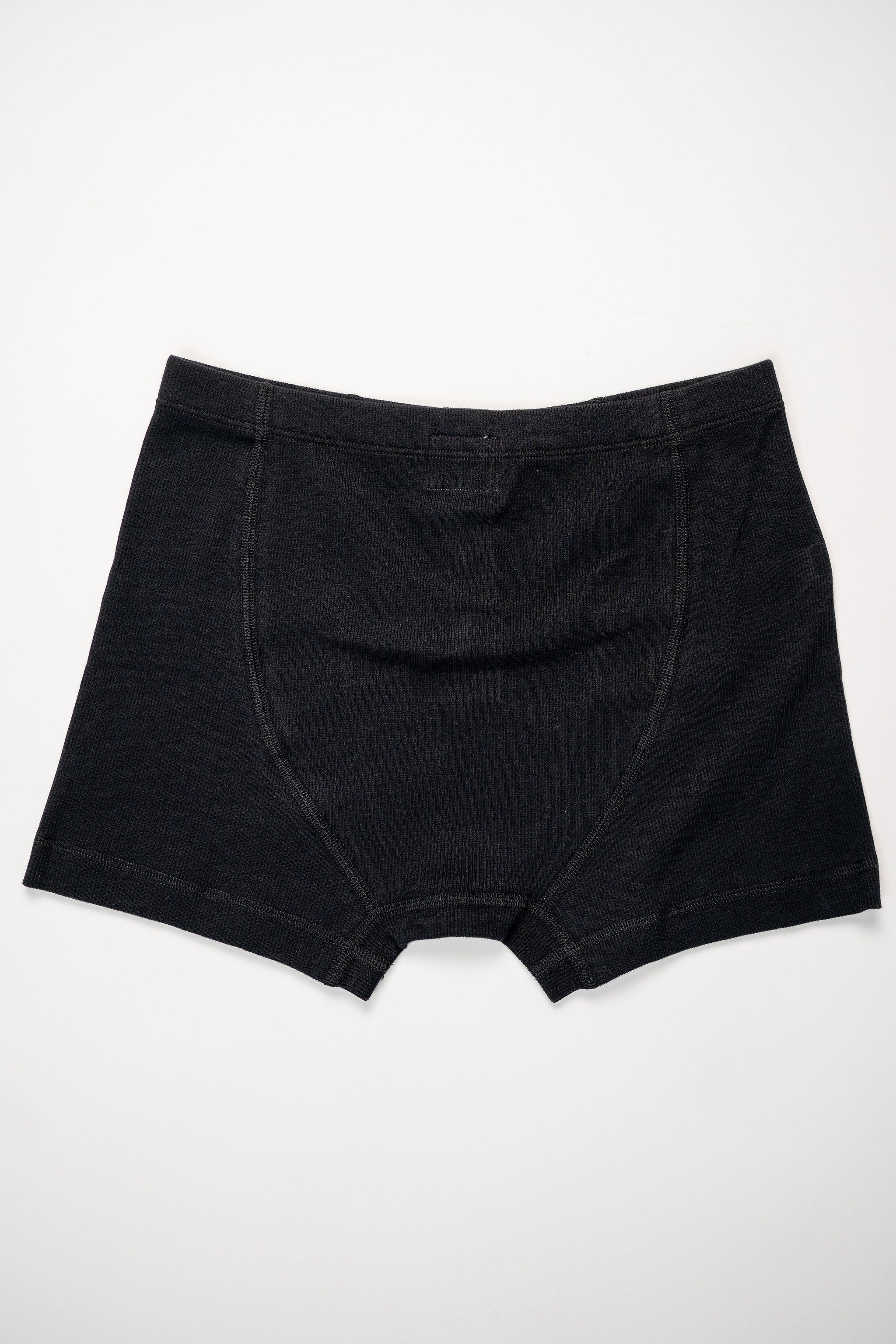 Hemen Biarritz Ribbed Boxer Brief - Solid Black. Laid on face.