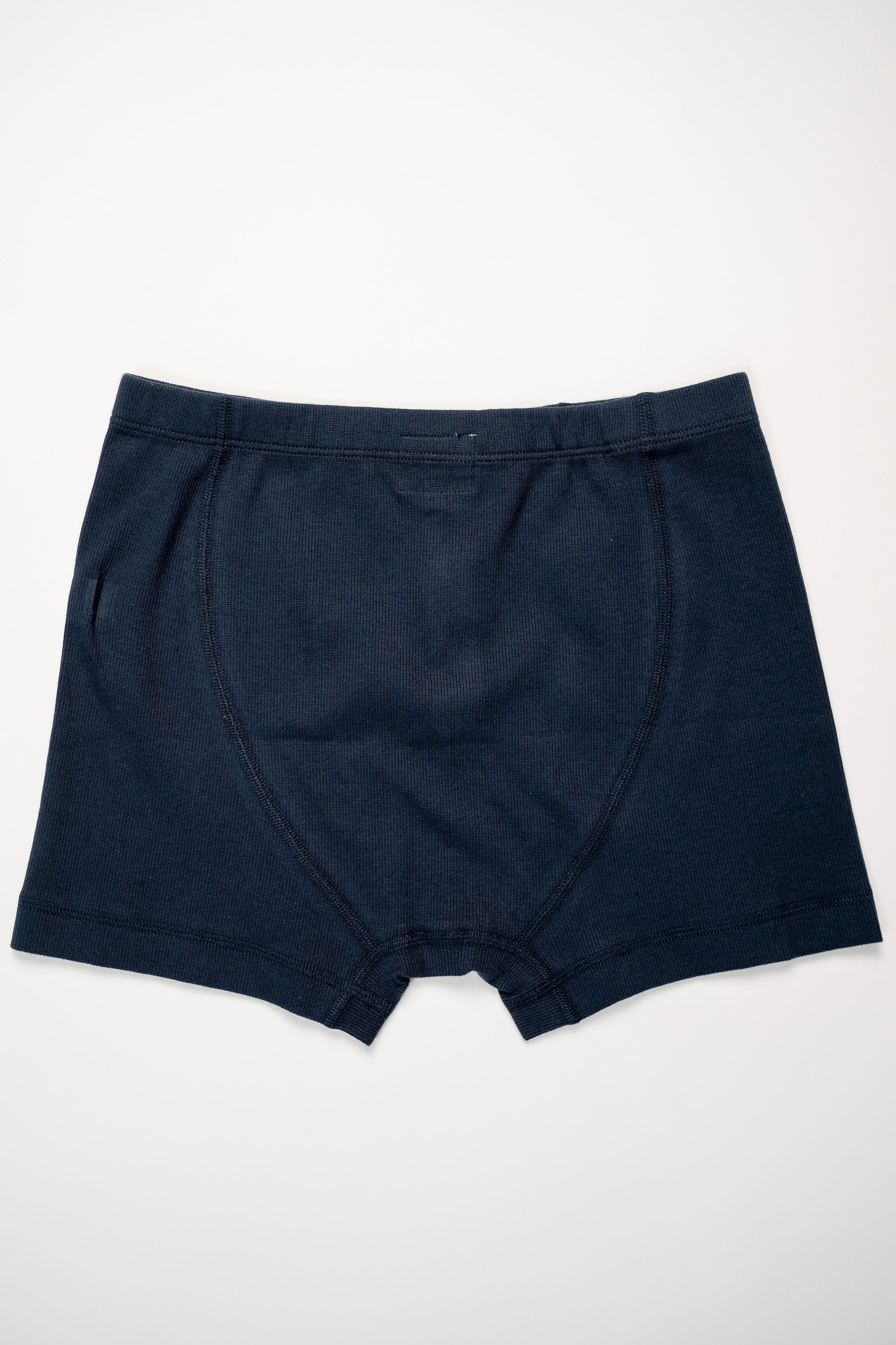 Hemen Biarritz Ribbed Boxer Brief - Deep Marine. laid on face