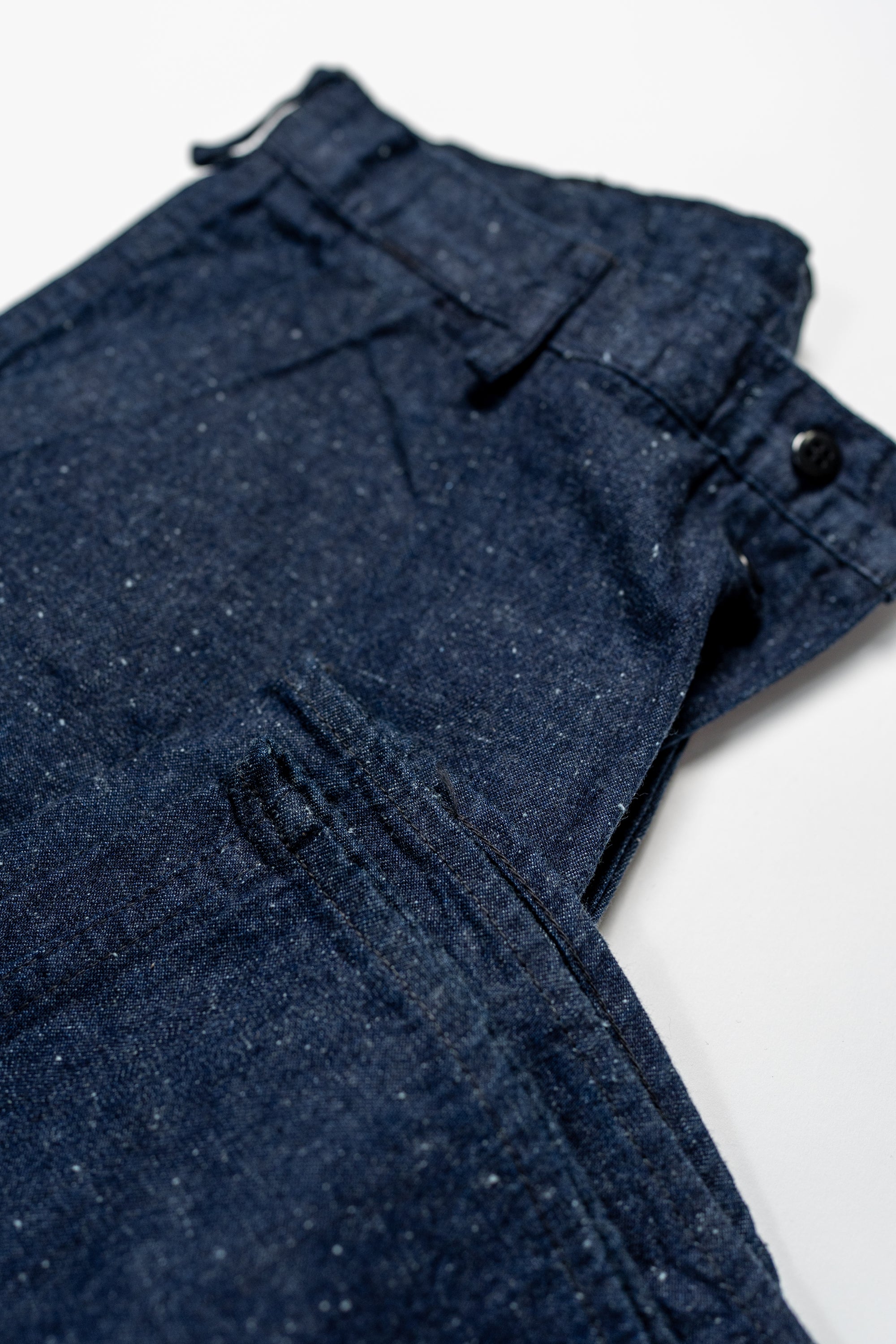 TCB Jeans Seamens Trousers - 10oz Neppy Denim Indigo One Wash. laid flat with cuff showing