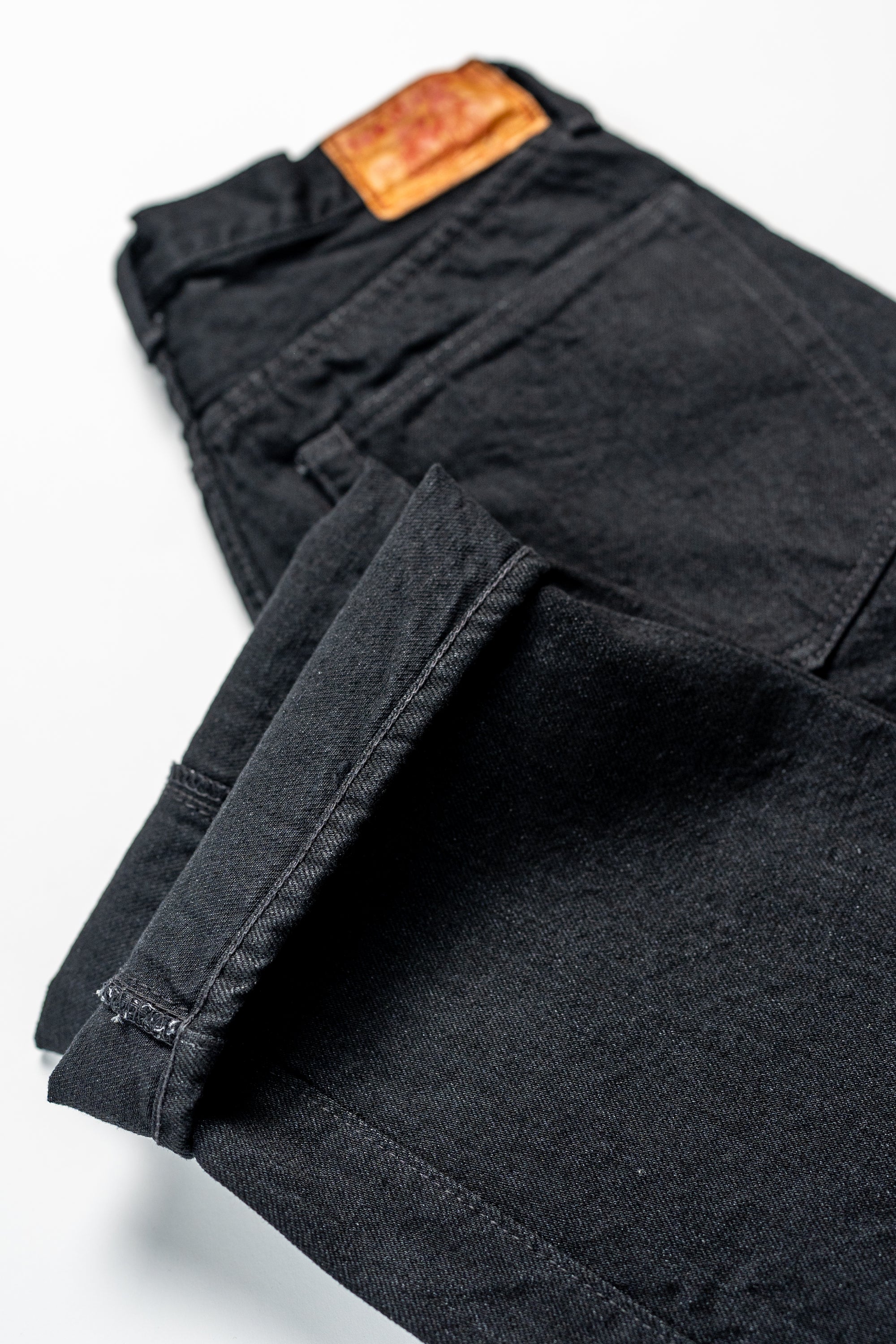TCB Jeans Late S40's Jeans BK - 14oz Black Denim One Wash. laid flat with close up of cuff