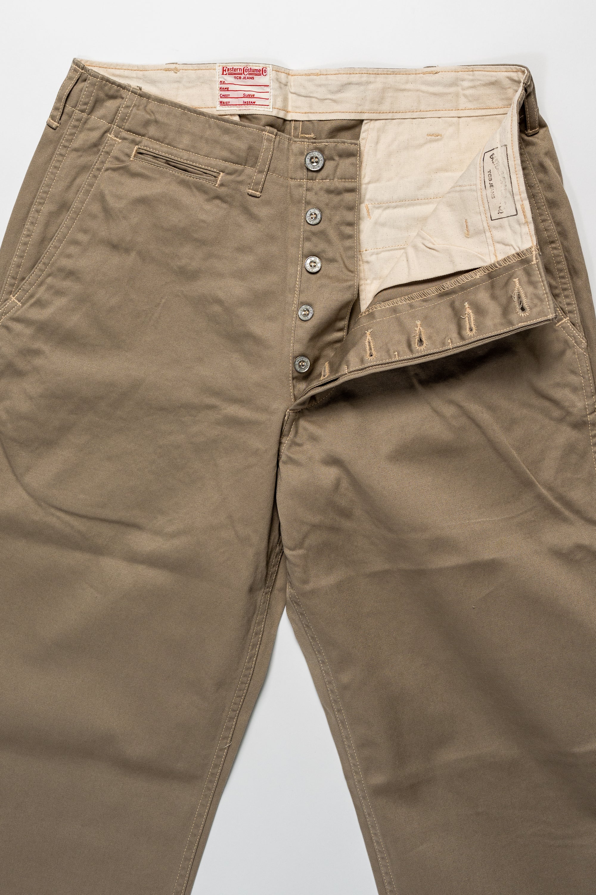 TCB Jeans Stay Gold Chino - 41 Khaki. laid on back with buttons undone