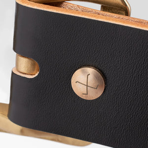 Obbi Good Label Single Prong Garrison Buckle Leather Belt - Hand-Dyed Black - Deltail of rivet logo on outside of belt