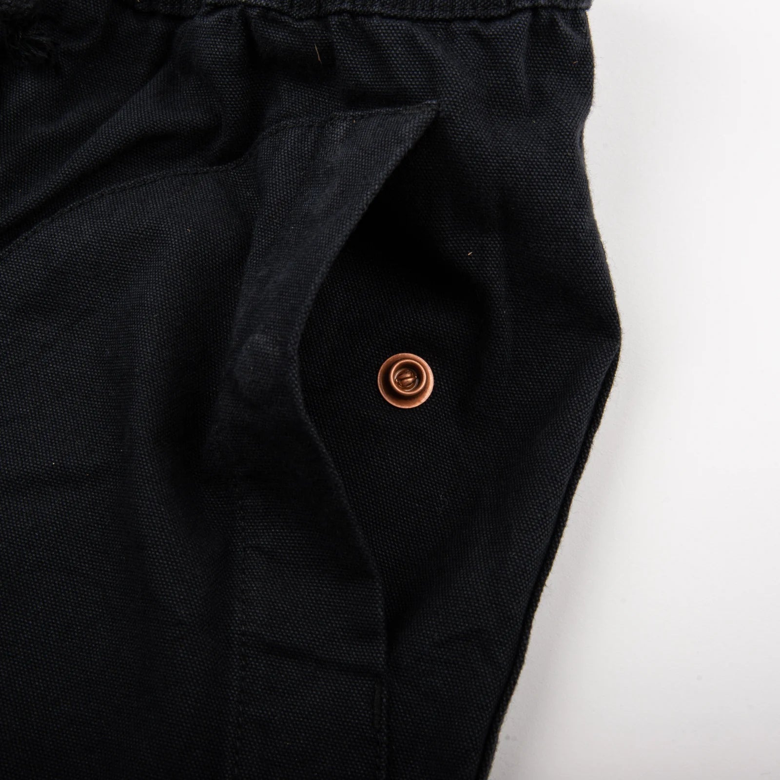 Freenote Cloth Deck Shorts - Black. detail shot of pocket snap