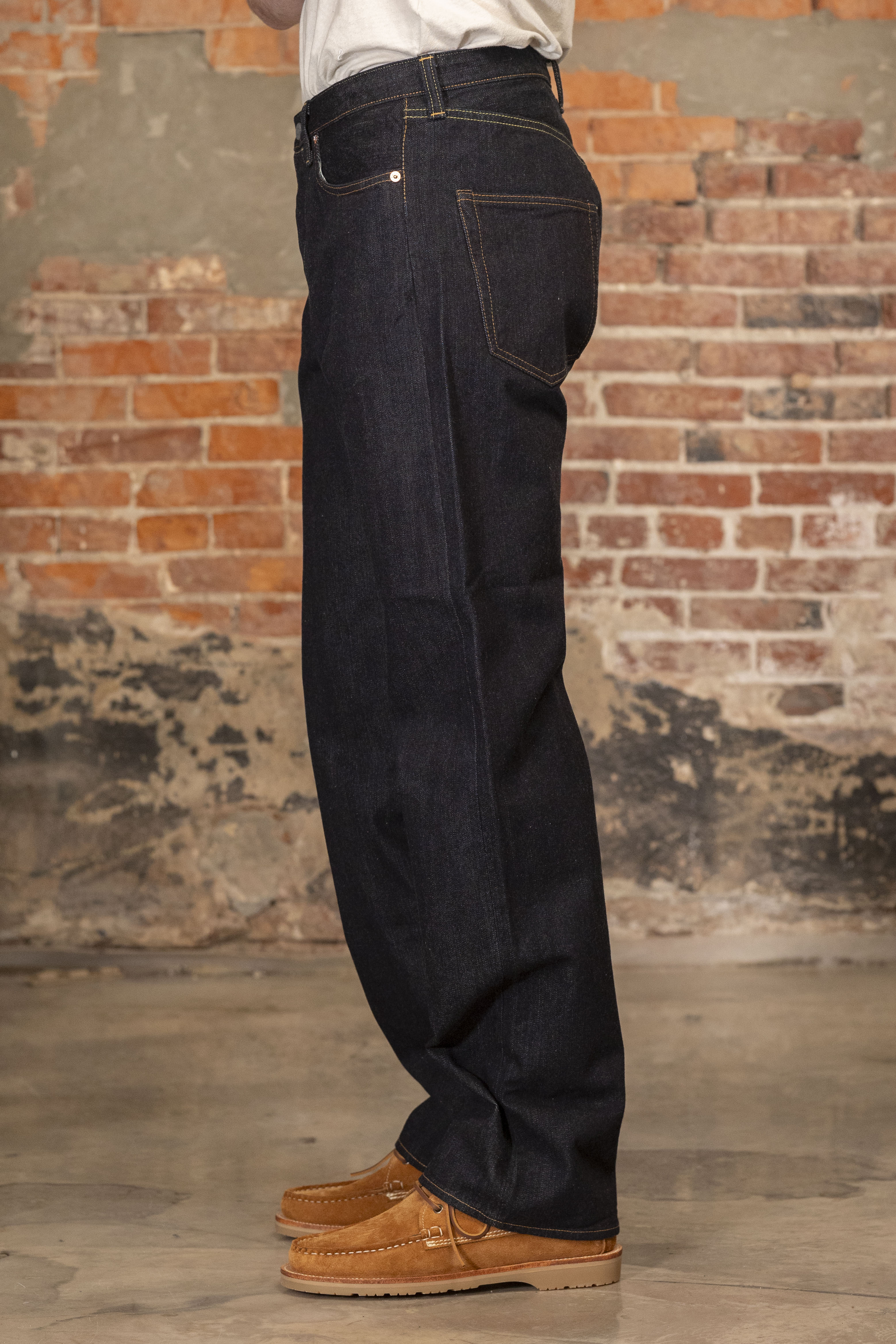 Indigo denim jeans wide cut side view on model