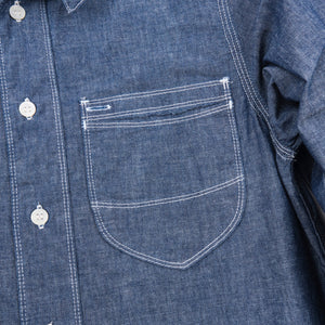 Shirt laid flat, from the front. Close up on left chest pocket. 