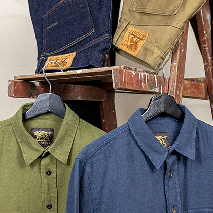 A mix of Indigofera shirts and pants display