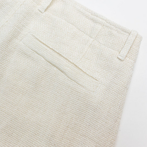 Hansen Garments Bobby Wide Pleated Trousers - Off White Gauze - product shot - close up - back facing - detail of pants pocket - white background
