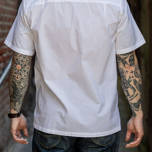 Hansen Garments Caleb Short Sleeve Cabana Shirt - White - model shot - back facing - alleyway backdrop