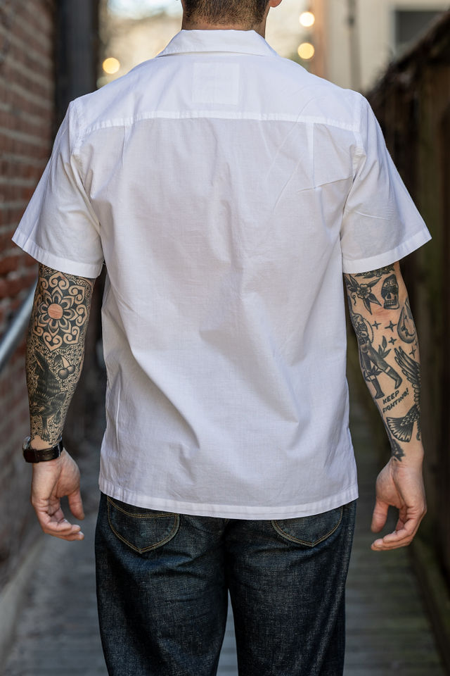 Hansen Garments Caleb Short Sleeve Cabana Shirt - White - model shot - back facing - alleyway backdrop
