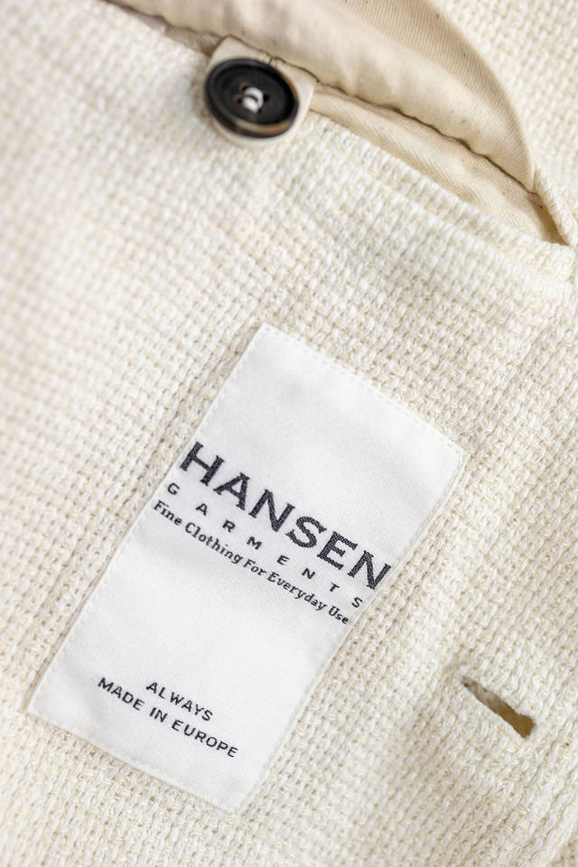 Hansen Garments Charlie Three Button Blazer - Off White Gauze - product shot - close up detail of tag, fabric, and button