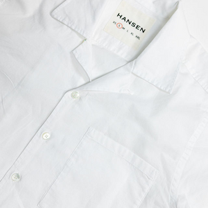 Hansen Garments Caleb Short Sleeve Cabana Shirt - White - product shot - front facing - white backdrop - detail shot of collar, buttons, pocket, and brand tag