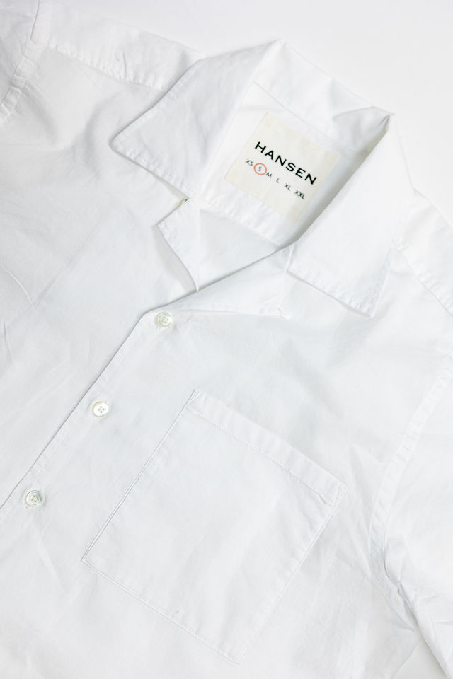 Hansen Garments Caleb Short Sleeve Cabana Shirt - White - product shot - front facing - white backdrop - detail shot of collar, buttons, pocket, and brand tag
